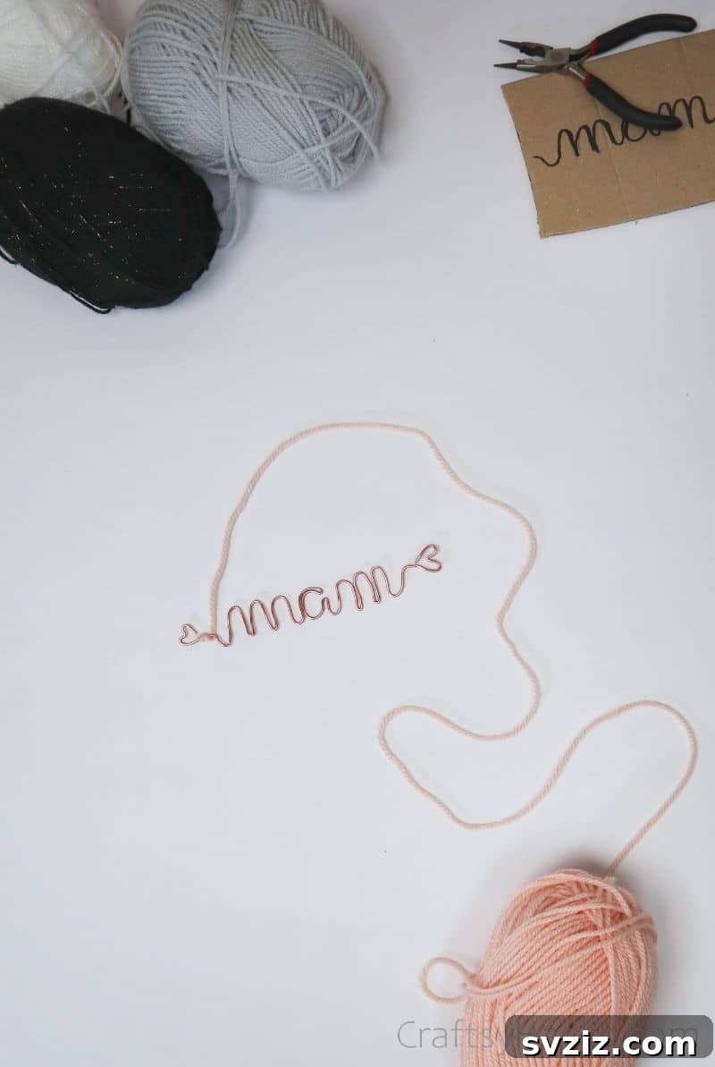 Stunning Wire Ornaments: Handmade Gifts You'll Adore 10 Yarn being tied around a shaped wire ornament