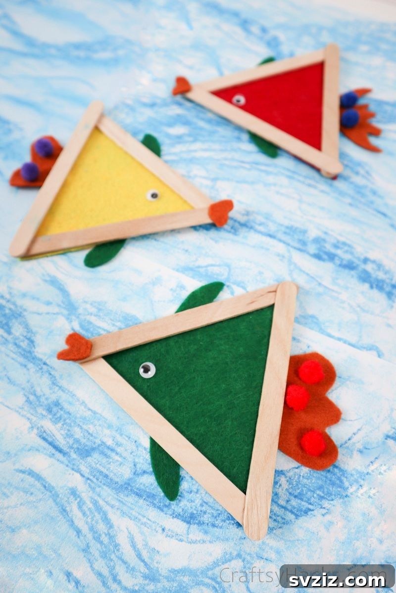 Simple Fish Crafts Kids Love to Make at School 3 Three completed colorful fish crafts displayed together.