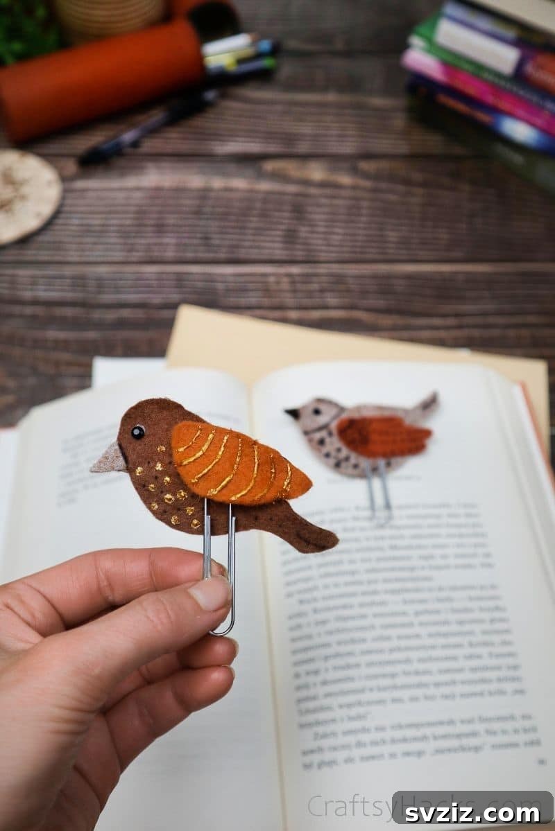 Creative Paper Clip Bookmarks 4 A hand holding a finished felt bird bookmark, showcasing its intricate details