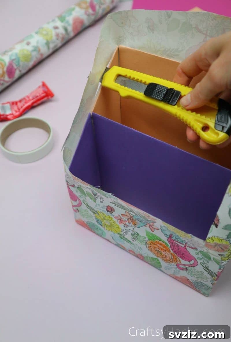 Trimming excess wrapping paper for a clean edge on the handmade desk organizer