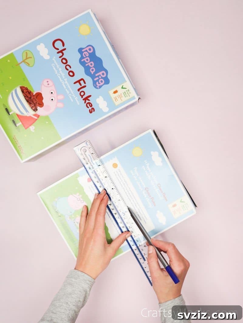 Measuring and drawing cut lines on a cereal box for a custom desk organizer