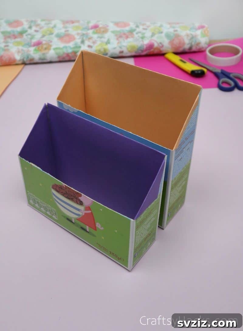 Cereal boxes neatly lined with vibrant colored paper, ready for assembly