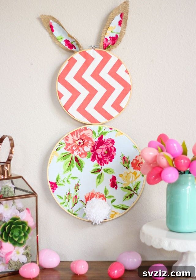 Creative Easter Projects for Adults 18 A creative Easter bunny decoration made from two embroidery hoops and fabric, hanging on a wall.