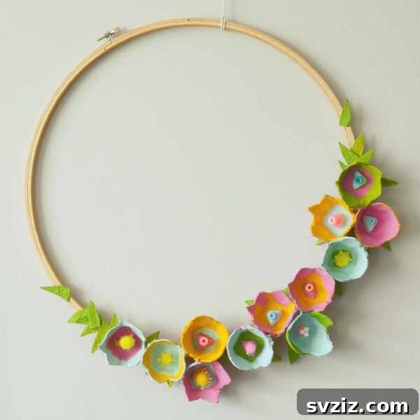 Creative Easter Projects for Adults 19 A vibrant flower wreath made from repurposed egg cartons, mounted on an embroidery hoop.