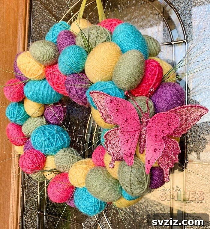 Creative Easter Projects for Adults 3 A colorful spring wreath adorned with yarn-wrapped Easter eggs and vibrant artificial flowers.