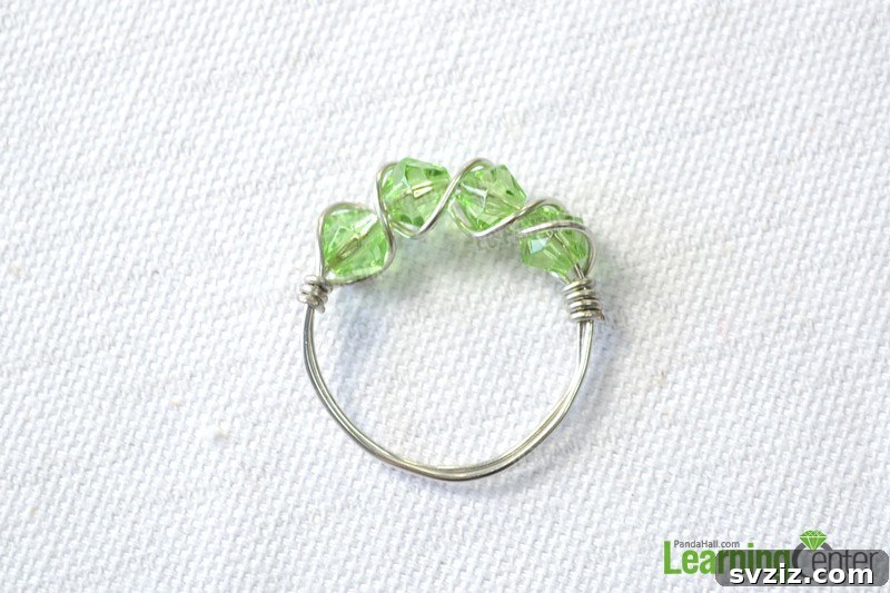 27 DIY Rings You'll Never Want to Take Off 15 Intricate DIY multi-bead wire-wrapped ring with green beads.