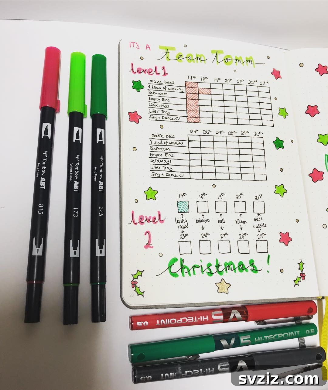 A holiday-themed bullet journal spread for cleaning, featuring festive decorations and categorized tasks for different areas of the house.