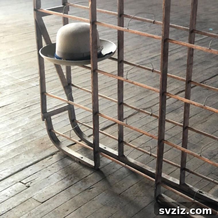 Vintage Millinery Rack for antique hat display, showcasing elegant hats on a classic stand.
