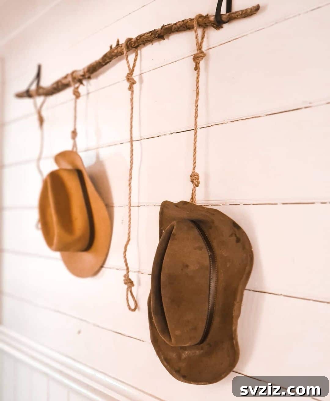 Simple Rope and Branch Rack for rustic hat display, featuring a natural branch suspended by leather straps.