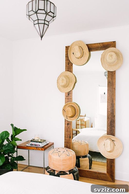 Mirror framed with hats for a unique display, showcasing a bohemian and artistic style.