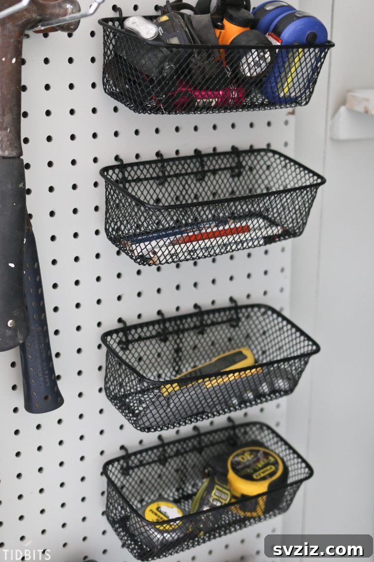 Pegboard with vertically stacked wire baskets for small tool storage