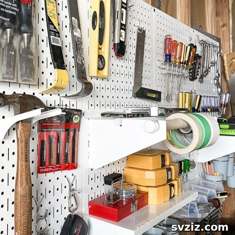 Neatly organized pegboard for tools in a workshop