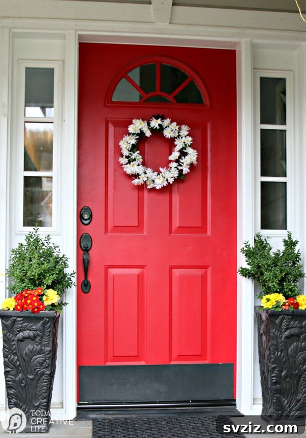 Summer Door Magic: 27 DIY Wreath Creations 7 Charming Daisy Wreath on a red door