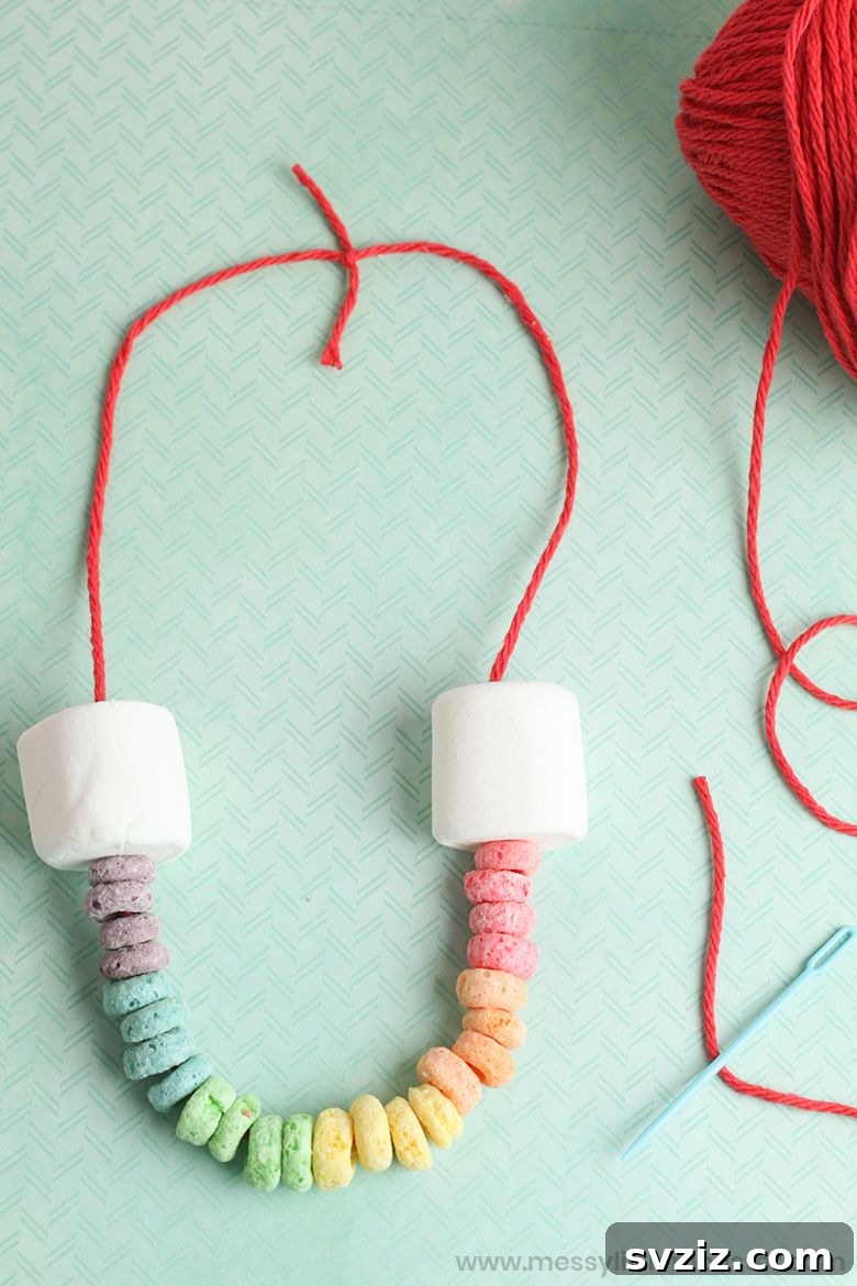 31 Fun Toddler Crafts They'll Adore 18 Edible rainbow threading craft with cereal for toddlers