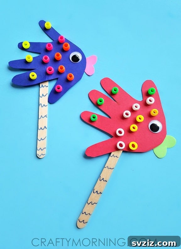 31 Fun Toddler Crafts They'll Adore 28 Handprint fish puppets for underwater adventures