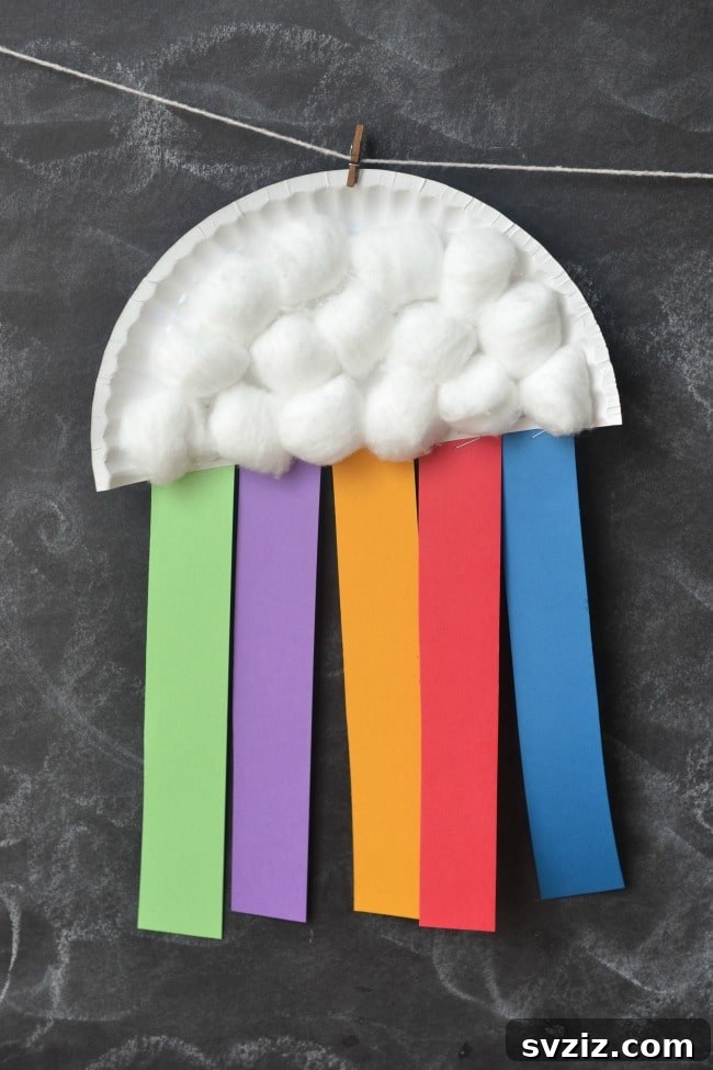 31 Fun Toddler Crafts They'll Adore 36 Paper plate rainbow craft with cotton ball clouds