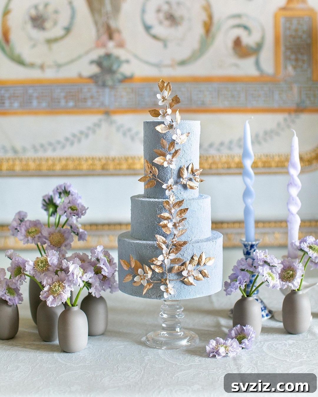 light blue cake with gold leaves