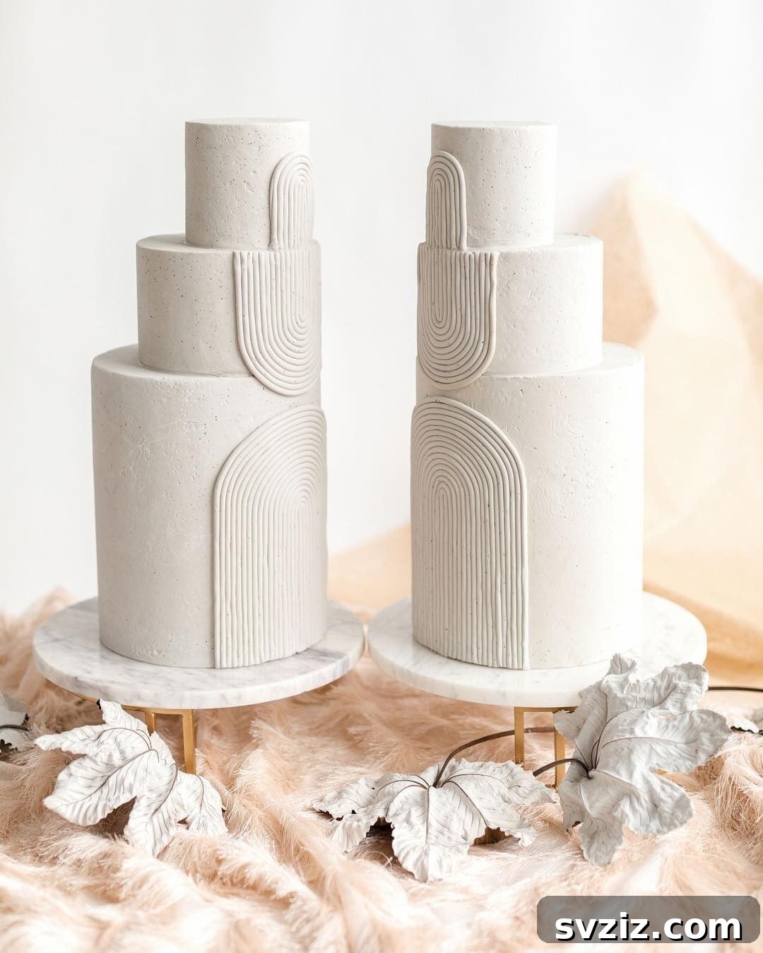 two cakes with white arches