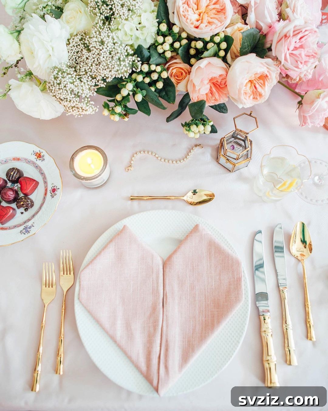 Charming wedding table decor with soft pastels, rose gold accents, and personalized trinkets.