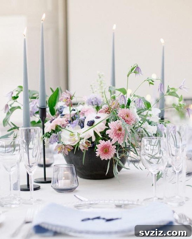 Sweet floral centerpiece with pink dahlias, hyacinths, and African violets, resembling an ice cream sundae.