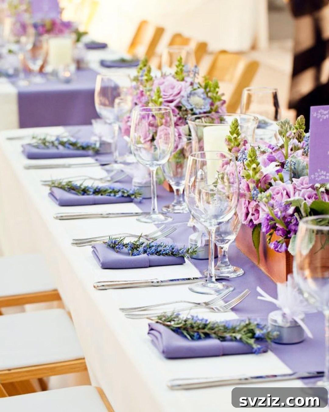 Elegant wedding table featuring lavender sprigs, violet napkins, and delicate succulent pots.